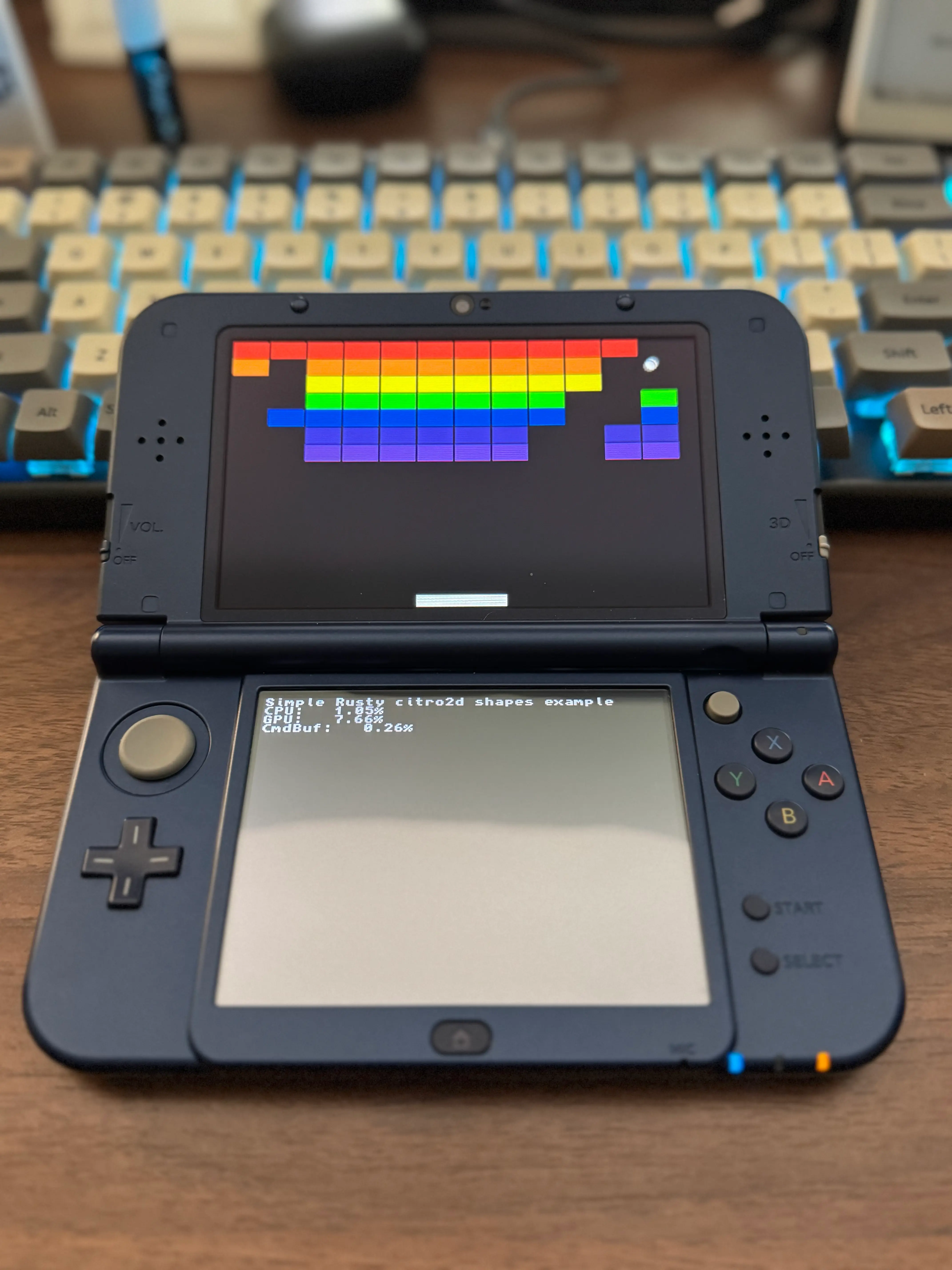 A picture of a 3DS showing the classic breakout game